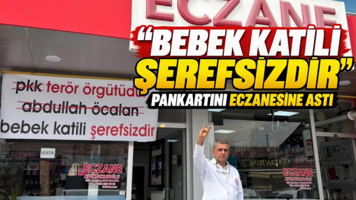 “BEBEK KATİLİ ŞEREFSİZDİR” PANKARTINI ECZANESİNE ASTI